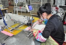 The oven mitt is sewed with computerized sewing machines, making sure that every piece is the same. The oven mitt is sewed with computerized sewing machines, making sure that every piece is the same.